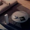 A white Xiaomi Smartmi Fan Heater is placed on a grey rug next to a round coffee table with a book and a cup of coffee. Voir les images du produit