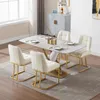 A dining room set with a table and four chairs, set on a rug. Produktbild-Vorschau
