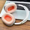 A pair of headphones rests on a laptop keyboard. Produktbild-Vorschau