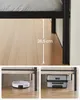 Collage showing a bed frame's clearance and its use with a robot vacuum and luggage. Náhled obrázku produktu