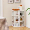 A white corner shelf unit filled with various items like bread, jars, a coffee grinder, and bottles, placed in a room with a checkered tablecloth visible on the left. Podgląd zdjęcia produktu