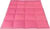 A pink blanket laid out flat on a white background.