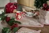 A festive Christmas table setting with gingerbread-themed decorations. Anteprima dell’immagine prodotto