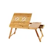 A wooden laptop table with foldable legs and a small drawer. Produktbild-Vorschau
