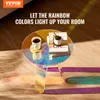 A round acrylic side table with a cup of coffee and books on it, casting colorful shadows on a wooden floor. Anteprima dell’immagine prodotto