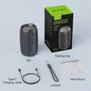 A product shot of a portable Bluetooth speaker and its accessories, along with its packaging. Produktbild-Vorschau