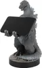 A Godzilla figurine holding a black rectangular object, standing on a base. Produktbild-Vorschau