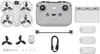 A flat lay of a drone and its accessories, including a remote controller, batteries, charging hub, propellers, and cables. Anteprima dell’immagine prodotto