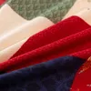 A close-up view of folded fabric with a floral and geometric pattern. Anteprima dell’immagine prodotto