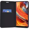 A black flip case for a smartphone, with a credit card inserted into a slot on the inside cover. The smartphone screen is visible and displays a colorful abstract wallpaper. Voir les images du produit
