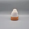 The back view of a single Adidas Handball Spezial sneaker against a plain gray background. Voir les images du produit