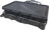 A black raclette grill is displayed on a white background. Voir les images du produit