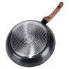 The underside of a frying pan with a wooden handle. Produktbild-Vorschau