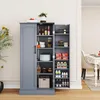 A gray pantry cabinet with its doors open, displaying various food items and kitchenware on its shelves. The cabinet is placed in a room with a dining table visible in the background. Produktbild-Vorschau