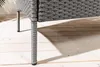 Close-up of the leg of a grey rattan garden bench on a wooden deck. Produktbild-Vorschau