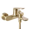 A close-up studio shot of a gold-colored bathtub faucet. Náhľad obrázku produktu
