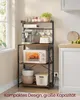 A kitchen shelf unit filled with appliances and cookware, placed next to a window and a cabinet. Produktbild-Vorschau