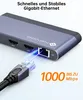 A close-up of a USB-C docking station with an Ethernet cable being plugged in, highlighting its connectivity features. Produktbild-Vorschau