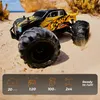 A remote-controlled monster truck driving on a sandy beach. Voir les images du produit