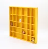 Woodweaver | Etagère en bois jaune 28 compartiments Voir les images du produit 1