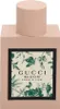 A perfume bottle with a floral and butterfly pattern on the label. Produktbild-Vorschau