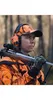 A hunter in camouflage gear with a rifle. Voir les images du produit