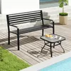 A black metal park bench and a small square side table are placed on a wooden deck next to a swimming pool. Produktbild-Vorschau