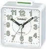 A white Casio analog alarm clock with a green snooze button on top. Produktbild-Vorschau