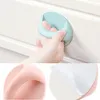 A collage of images showing self-adhesive handles for drawers and cabinets, with a close-up of a child's hand using one and another showing the adhesive backing. Produktbild-Vorschau
