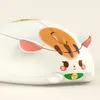 A close-up, studio shot of a white computer mouse designed to look like a cute cat. Náhled obrázku produktu