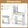 A diagram showing the dimensions of a white vanity table and stool set. Voir les images du produit