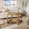 A living room scene with a couch, coffee table, and plant. Produktbild-Vorschau