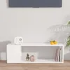 A white TV stand against a white wall, with decorative items on top and inside. Náhľad obrázku produktu