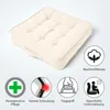 A cream-colored square seat cushion is shown on a white background, with several icons and text describing its features. Produktbild-Vorschau