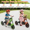 Two children riding electric tricycles on a paved path outdoors. Produktbild-Vorschau