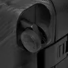 A close-up view of a black suitcase wheel and handle. Podgląd zdjęcia produktu