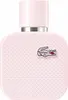 A close-up, studio shot of a pink Lacoste perfume bottle. Anteprima dell’immagine prodotto