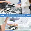 People using small digital scales at a counter, possibly in a retail or laboratory setting. Produktbild-Vorschau
