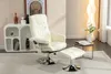 A beige recliner chair with a matching ottoman is shown in a well-lit room with a modern white shelving unit and a floor lamp. Produktbild-Vorschau