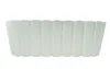 A white planter with vertical ribbed detailing. Voir les images du produit