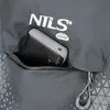 A close-up view of a gray backpack pocket with a black and silver power bank inside. Anteprima dell’immagine prodotto