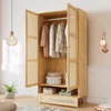 A wooden wardrobe with open doors, showing clothes on hangers and storage boxes inside. Produktbild-Vorschau