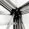 Close-up view of the corner joint of a greenhouse structure, showing metal framing and polycarbonate panels. Produktbild-Vorschau