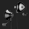A close-up studio shot of two black earphones against a black background, with measurement indicators. Podgląd zdjęcia produktu