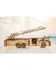 A wooden model fire truck with an extended ladder is displayed on a white surface with a blurred background. Produktbild-Vorschau