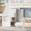 A white loft bed with stairs and a built-in wardrobe, set in a child's bedroom with a desk and a sofa. Produktbild-Vorschau