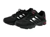A pair of black athletic shoes with silver accents and red detailing. Produktbild-Vorschau