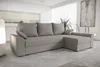 A light gray sectional sofa is shown in a modern living room setting. Náhled obrázku produktu