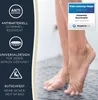 A person's feet are standing on a shower mat in a shower, with water droplets visible. Produktbild-Vorschau