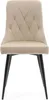 A front view of a beige upholstered dining chair with black legs, set against a white background. Podgląd zdjęcia produktu